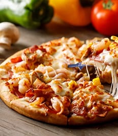 Попробуйте вкусную пиццу и сочные блюда на мангале со скидкой 50% от кафе